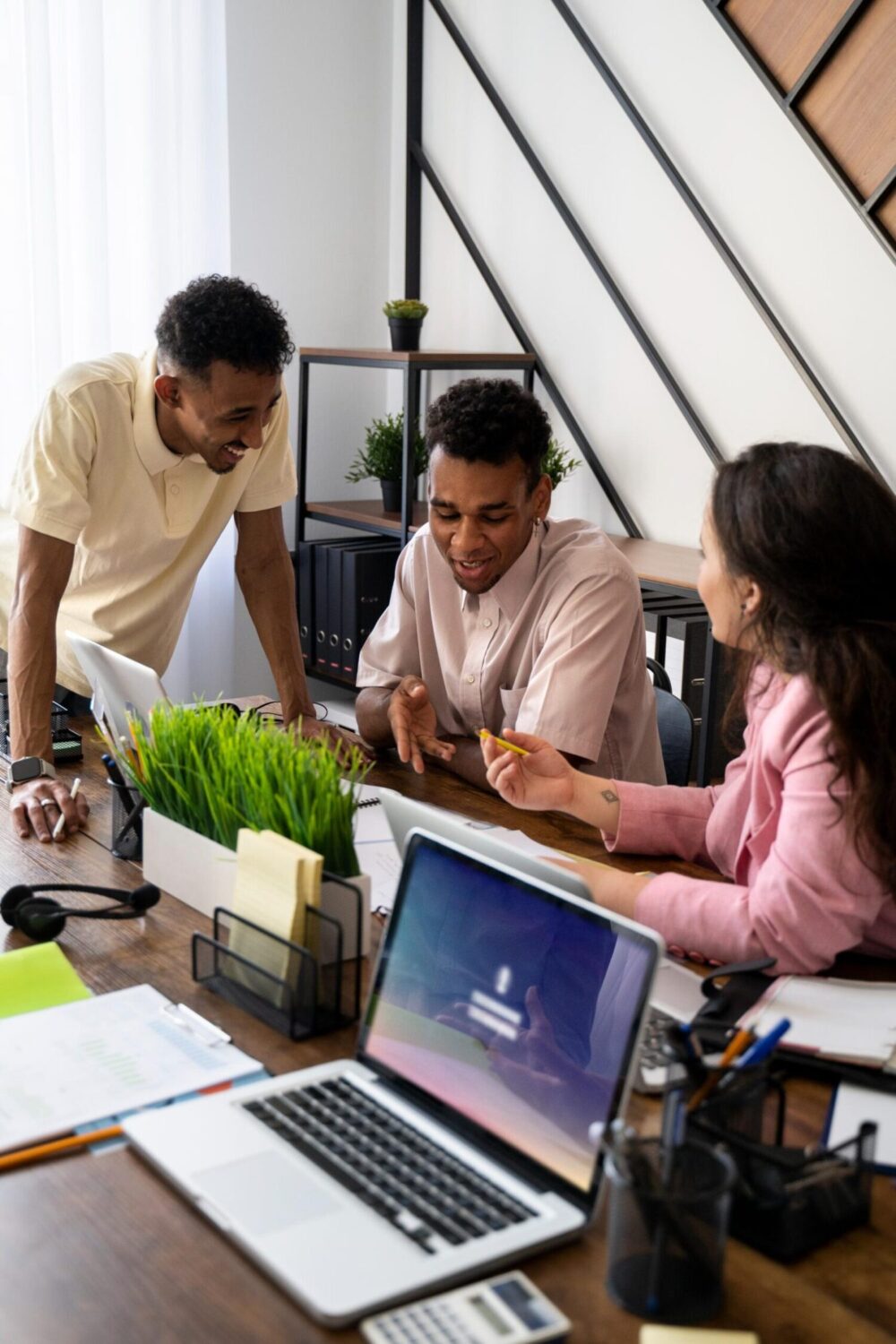 side view people working together 1 scaled e1708623718868.jpg